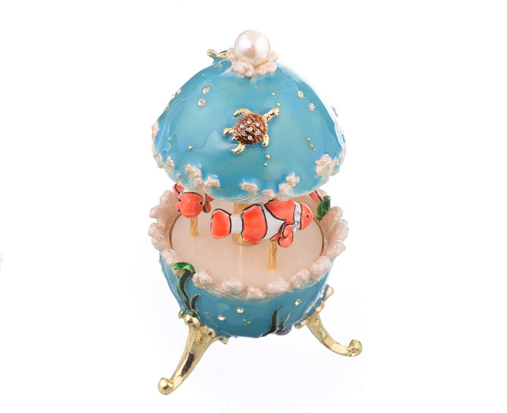 Clownfish Musical Carousel trinket box with Austrian crystals and gold plating, showcasing intricate enamel work and a secure magnetic closure.