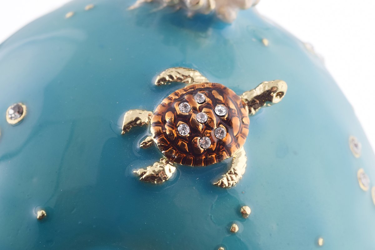 Clownfish Musical Carousel trinket box with Austrian crystals and gold plating, showcasing intricate enamel work and a secure magnetic closure.