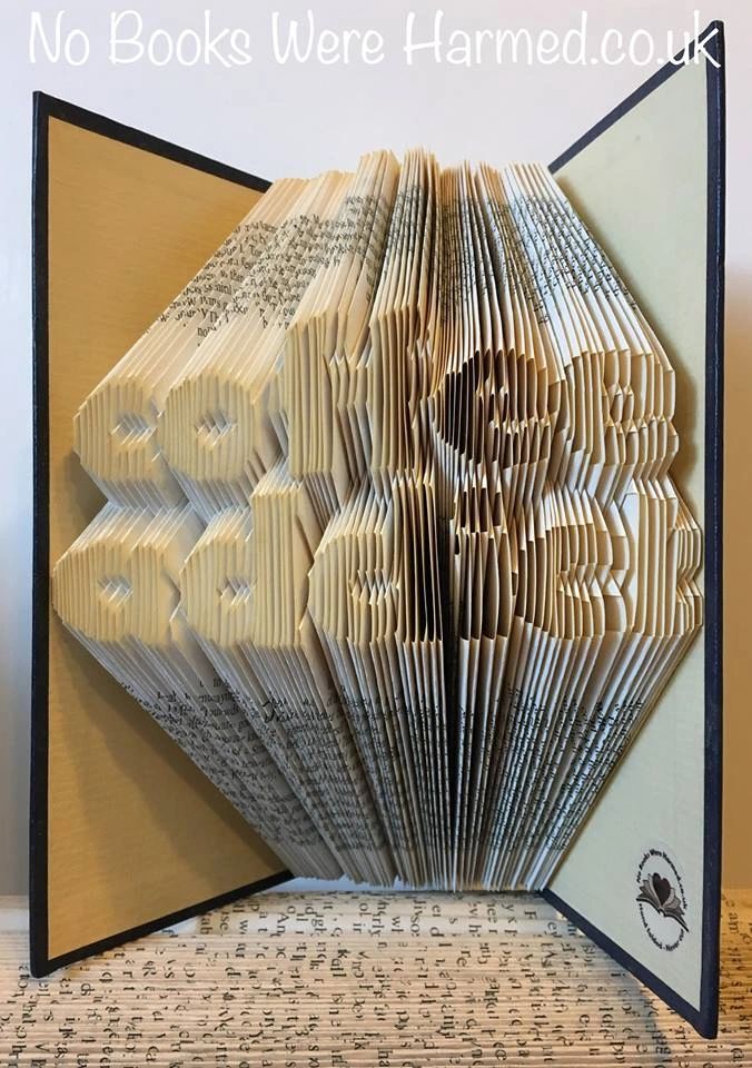 Handcrafted coffee-themed book art made from vintage pages, showcasing intricate folds and unique design.