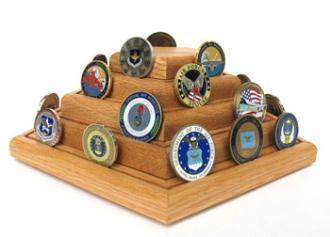 Elegant oak pyramid coin display holder showcasing military challenge coins.