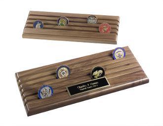Walnut wood coin display rack with 6 rows, showcasing 36 military challenge coins, featuring shell casings for elevation.