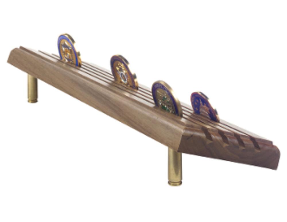 A beautifully crafted walnut wood coin display stand holding up to 48 military challenge coins, showcasing their intricate designs.