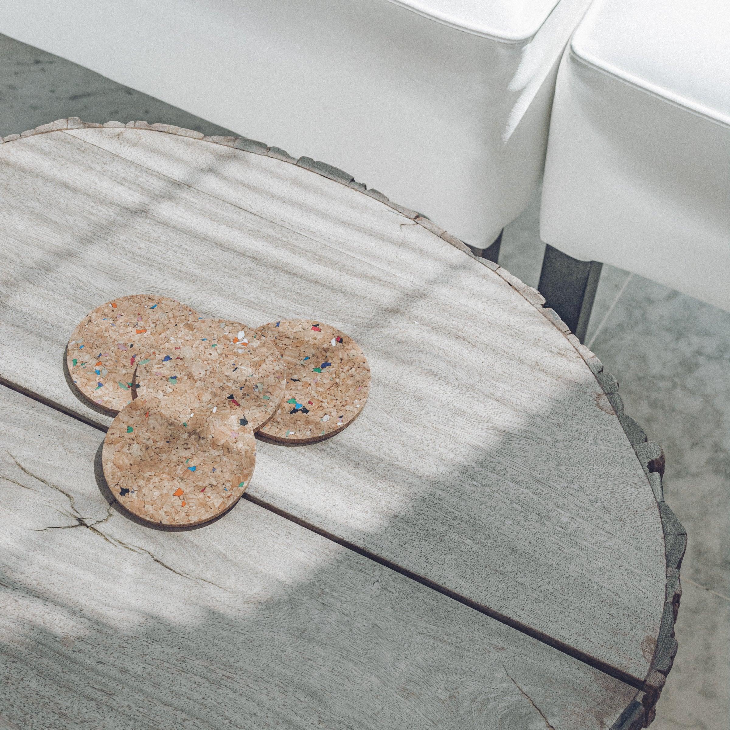 Set of 6 round coloured cork coasters with vibrant patterns, perfect for home decor and protecting surfaces.