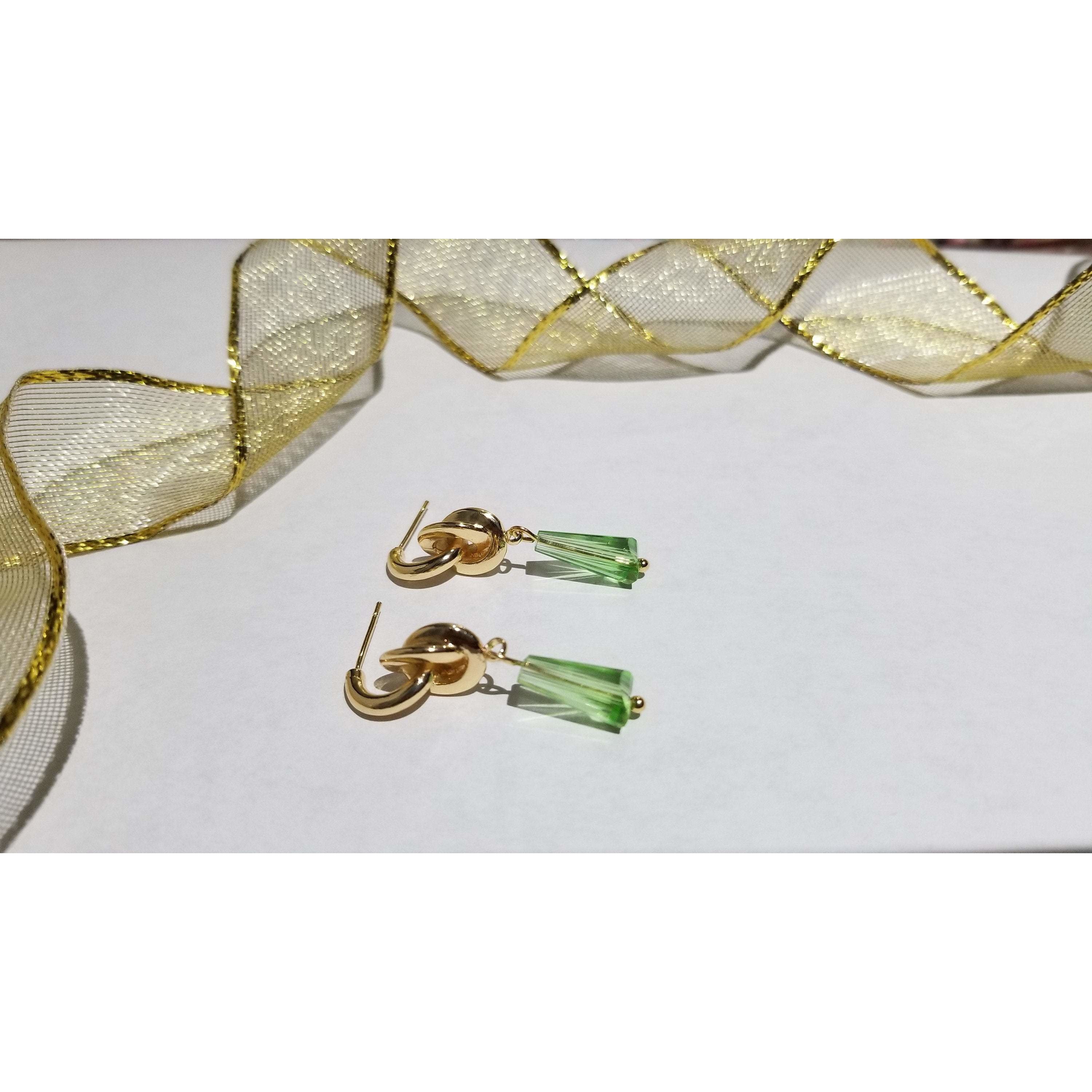 Elegant conical crystal beads on golden knot ear studs, showcasing a trendy brass design with a luxurious 24K gold color plating.