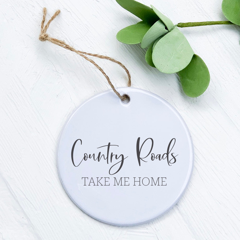 Country Roads Take Me Home porcelain ornament featuring a vibrant rural design, perfect for holiday decor or gifting.