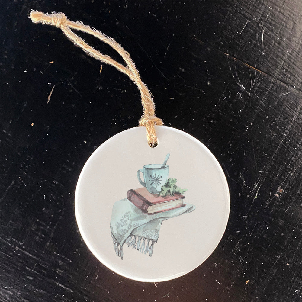 Cozy Book Ornament made of high-quality porcelain with a vibrant design, perfect for holiday gifting and decoration.