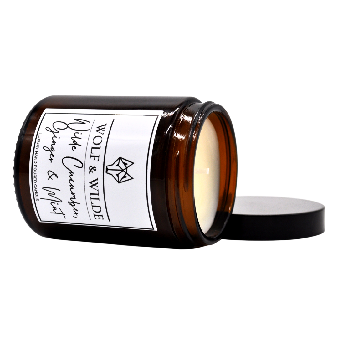 Cucumber, Ginger & Mint Luxury Aromatherapy Scented Candle in an elegant glass jar with a refreshing green floral design.