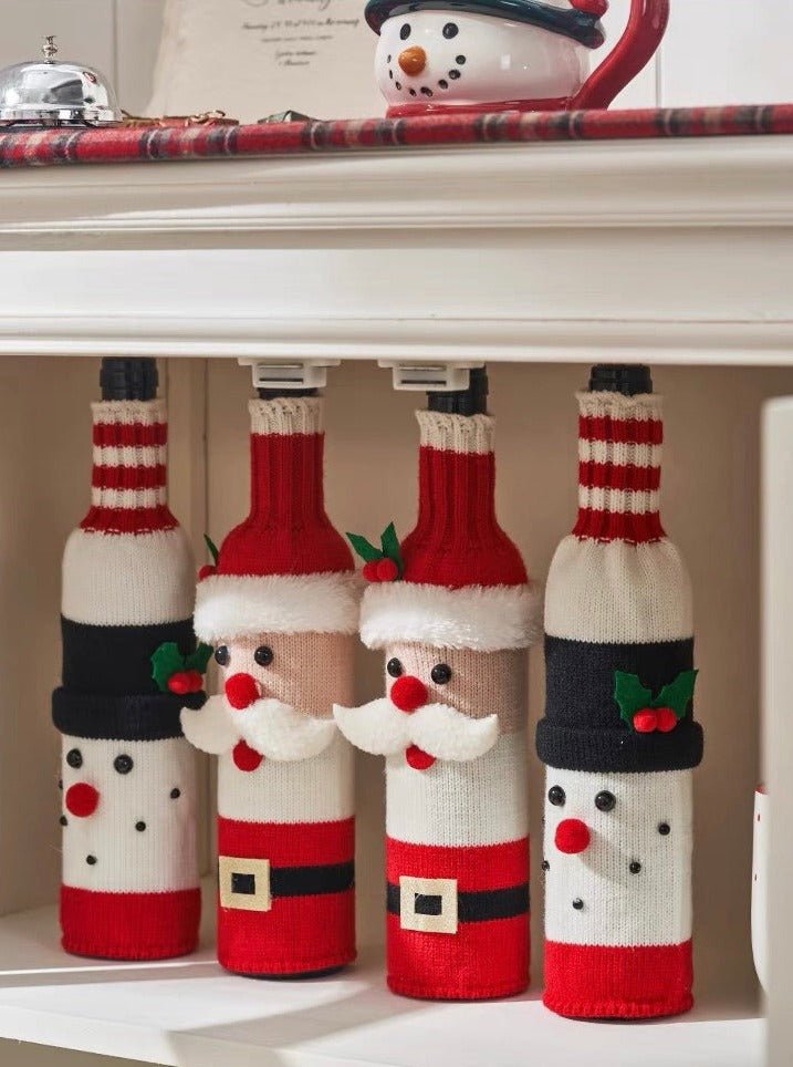 Set of three knitted Christmas wine bottle covers featuring Santa, Rudolph, and a Snowman, perfect for holiday decor.
