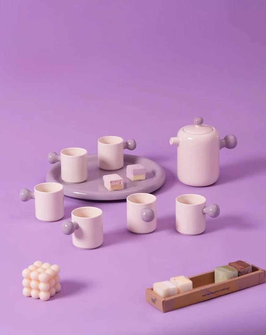 Cute Bauhaus inspired ceramic tea pot and tea cups set with vibrant dopamine colors, perfect for stylish tea gatherings.