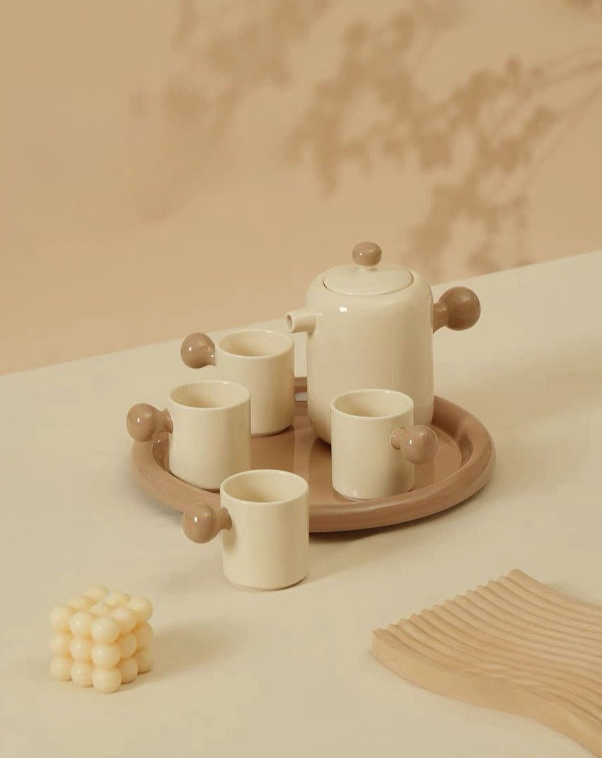 Cute Bauhaus inspired ceramic tea pot and tea cups set with vibrant dopamine colors, perfect for stylish tea gatherings.