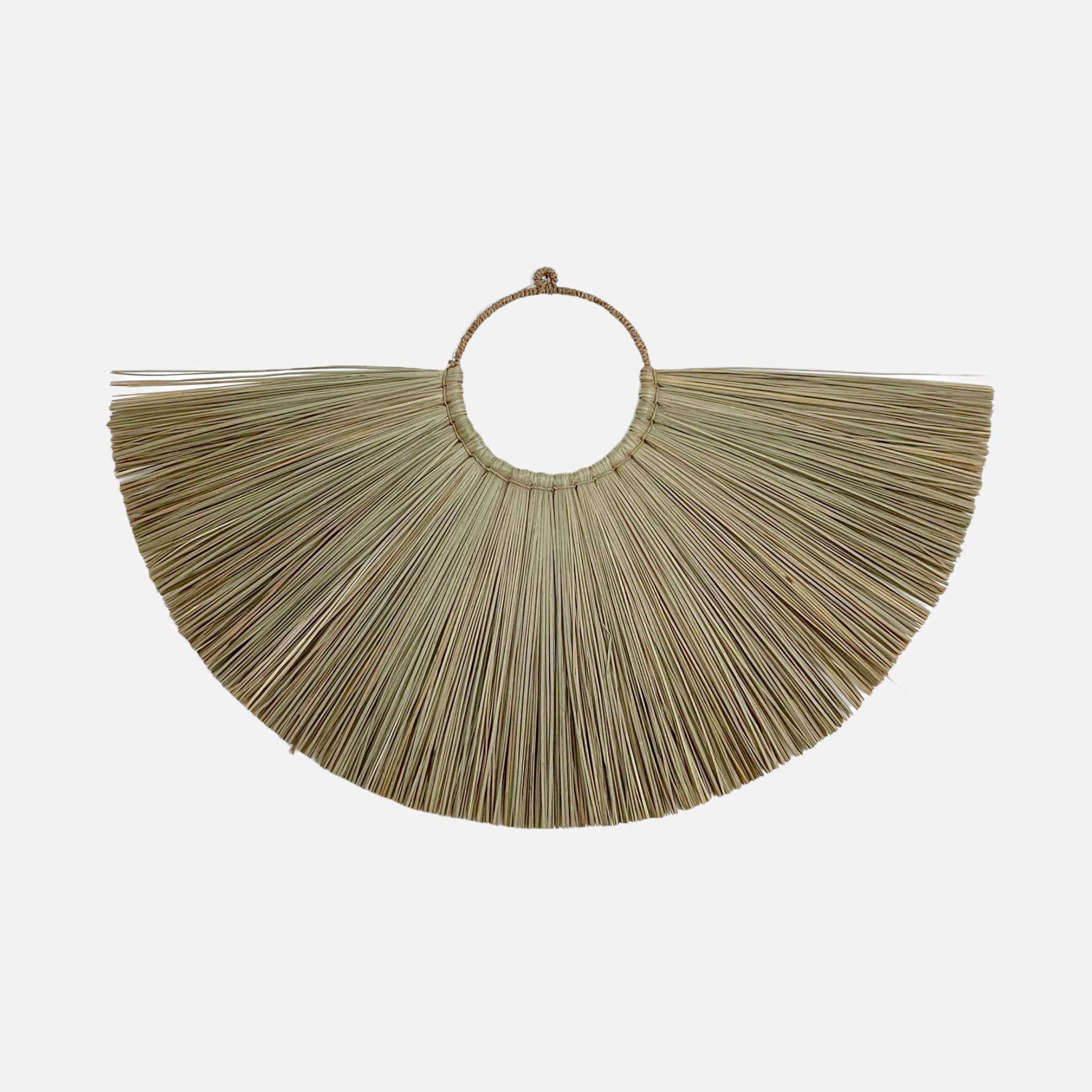 Jingga Allang wall decoration made of natural grass, showcasing a bohemian design with intricate weaving, perfect for enhancing interior spaces.