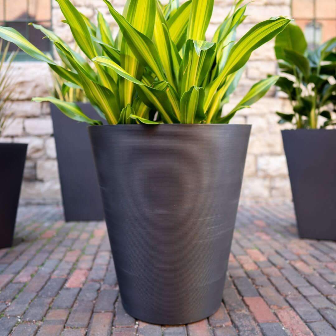 Decorative Textured Round Black Planter, 47cm tall, made from recycled materials with a unique textured surface.