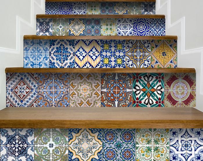 A colorful set of 24 decorative peel and stick tile stickers displayed on a smooth surface, showcasing various unique designs.