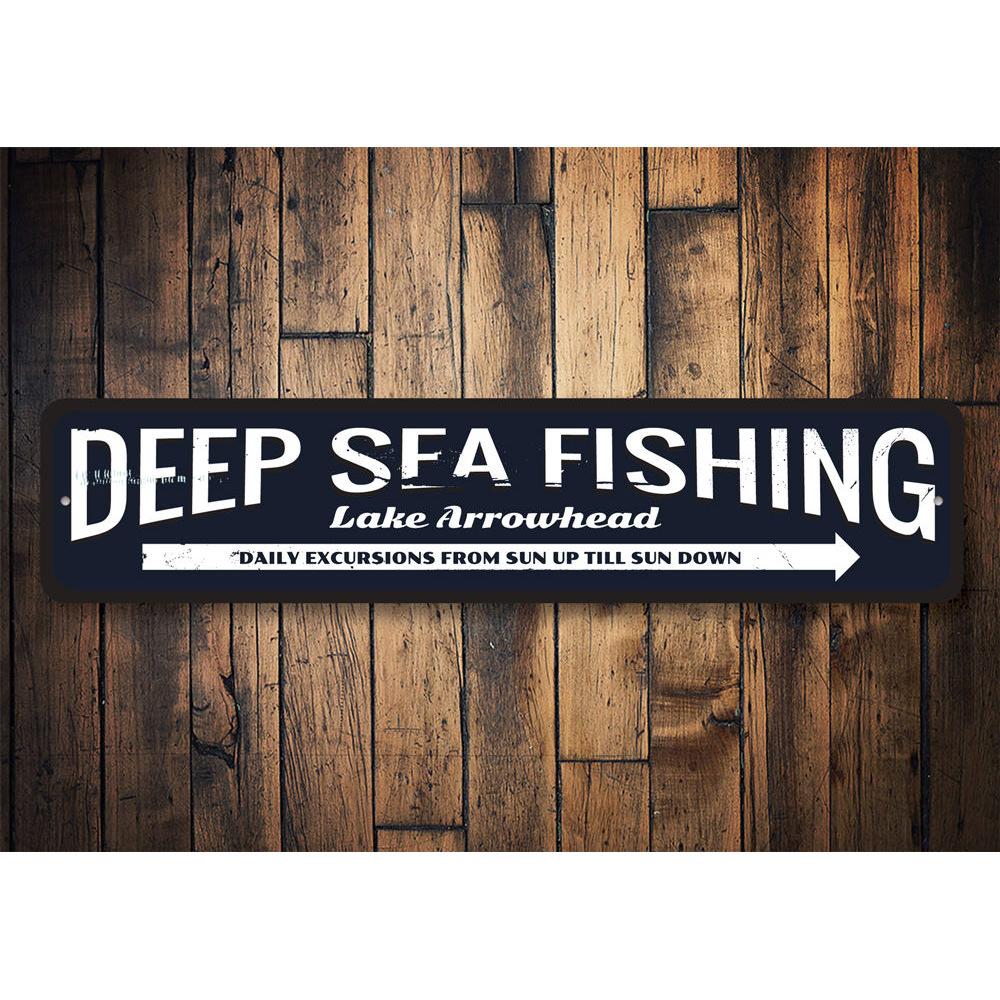 Deep Sea Fishing Arrow Sign made of durable aluminum, featuring a nautical design perfect for coastal decor.