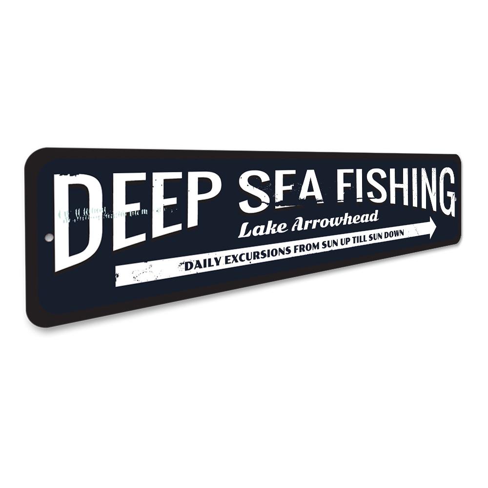 Deep Sea Fishing Arrow Sign made of durable aluminum, featuring a nautical design perfect for coastal decor.