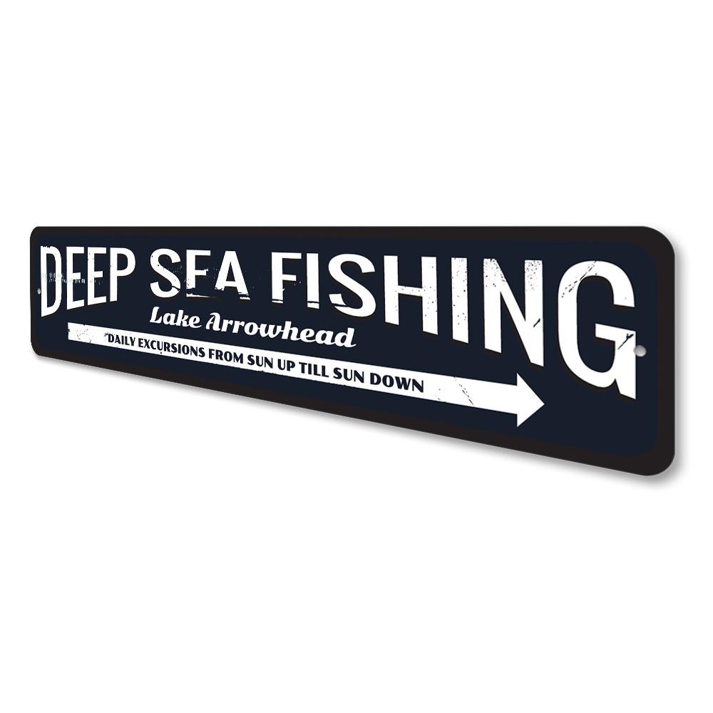 Deep Sea Fishing Arrow Sign made of durable aluminum, featuring a nautical design perfect for coastal decor.