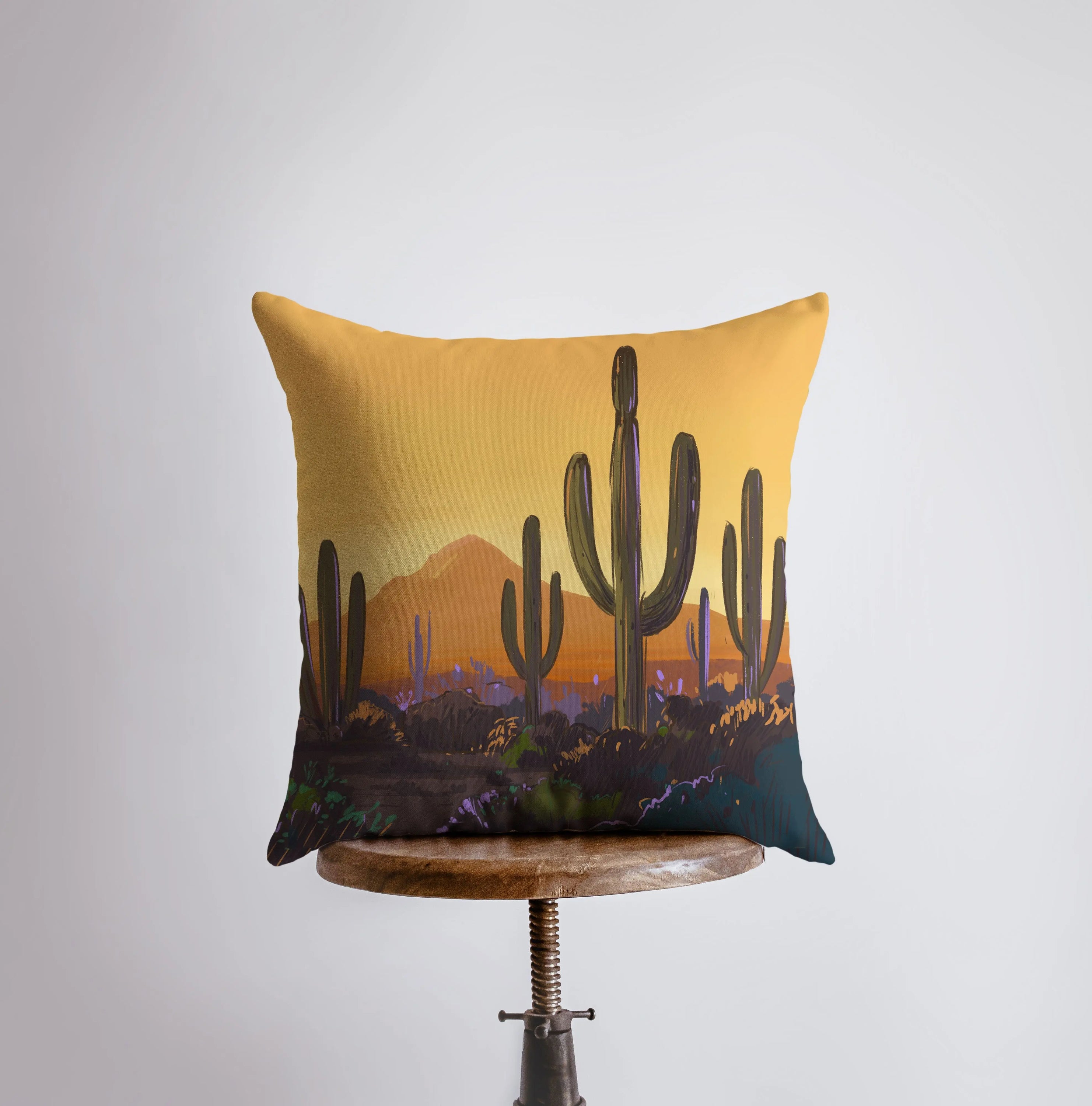 Arizona landscape pillow featuring sunrise and sunset scenes, showcasing vibrant colors and a cozy design.