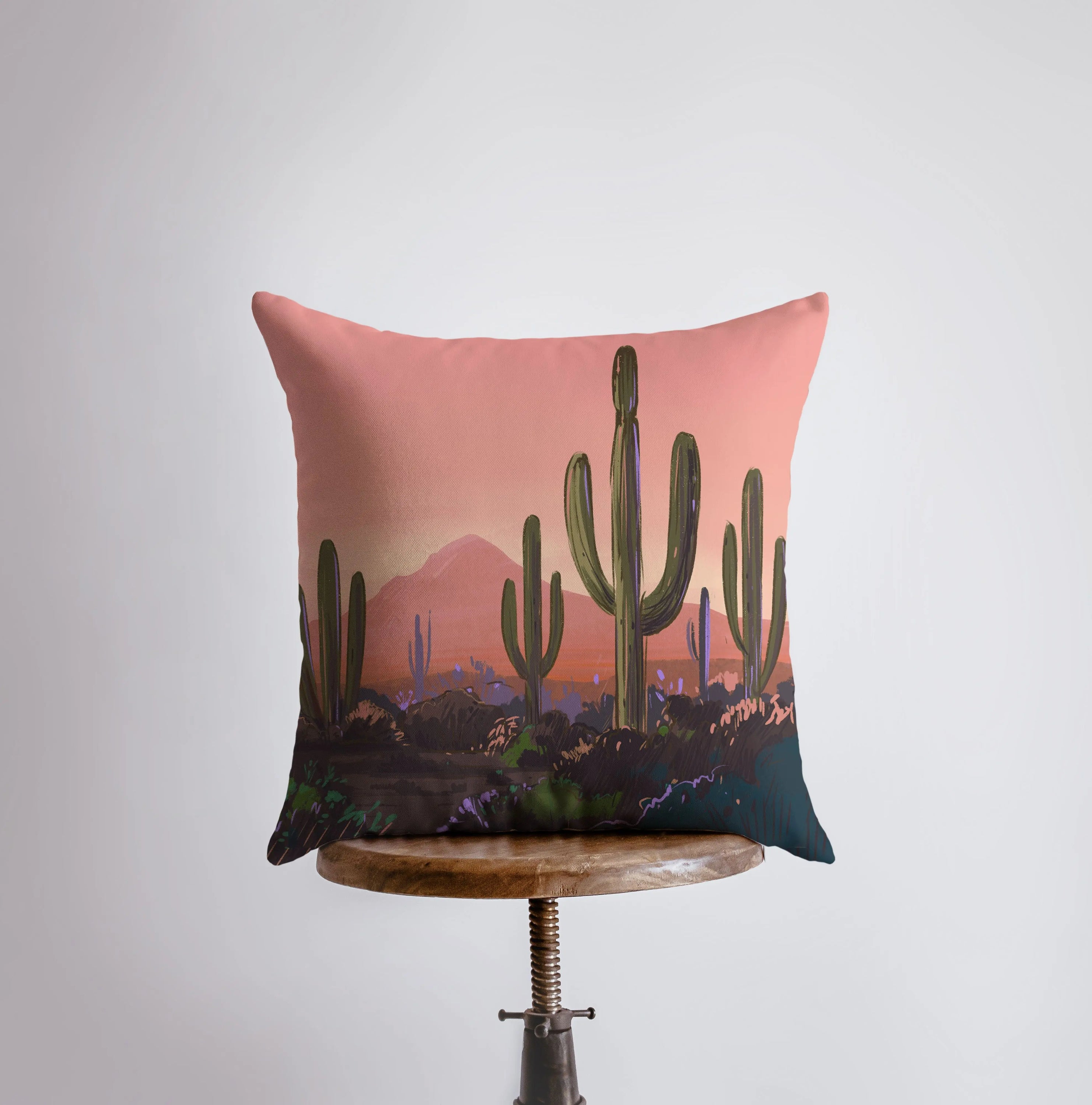 Arizona landscape pillow featuring sunrise and sunset scenes, showcasing vibrant colors and a cozy design.