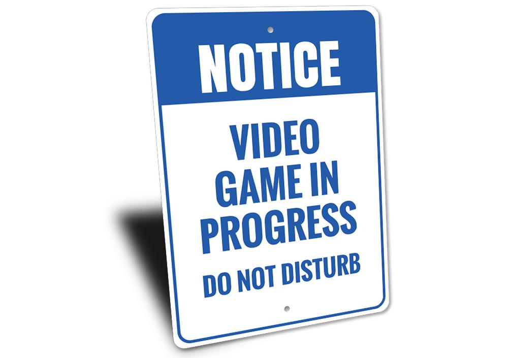 A decorative Do Not Disturb Video Game Sign made of aluminum, featuring vibrant colors and customizable text, perfect for gaming rooms.