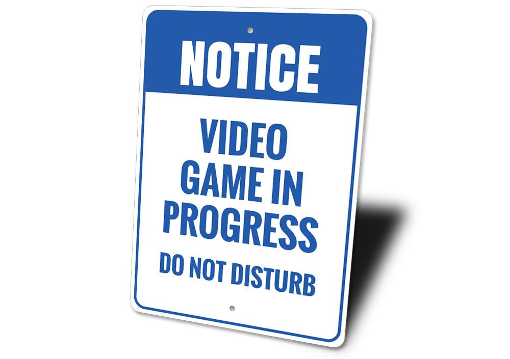 A decorative Do Not Disturb Video Game Sign made of aluminum, featuring vibrant colors and customizable text, perfect for gaming rooms.