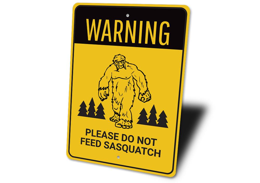A humorous Do Not Feed Sasquatch Sign made of high-quality aluminum, featuring a playful design perfect for home decor.