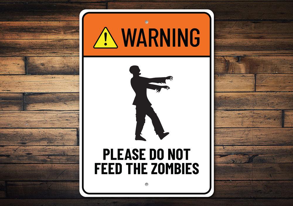 A decorative Do Not Feed Zombies sign made of aluminum, featuring spooky graphics perfect for Halloween decor.