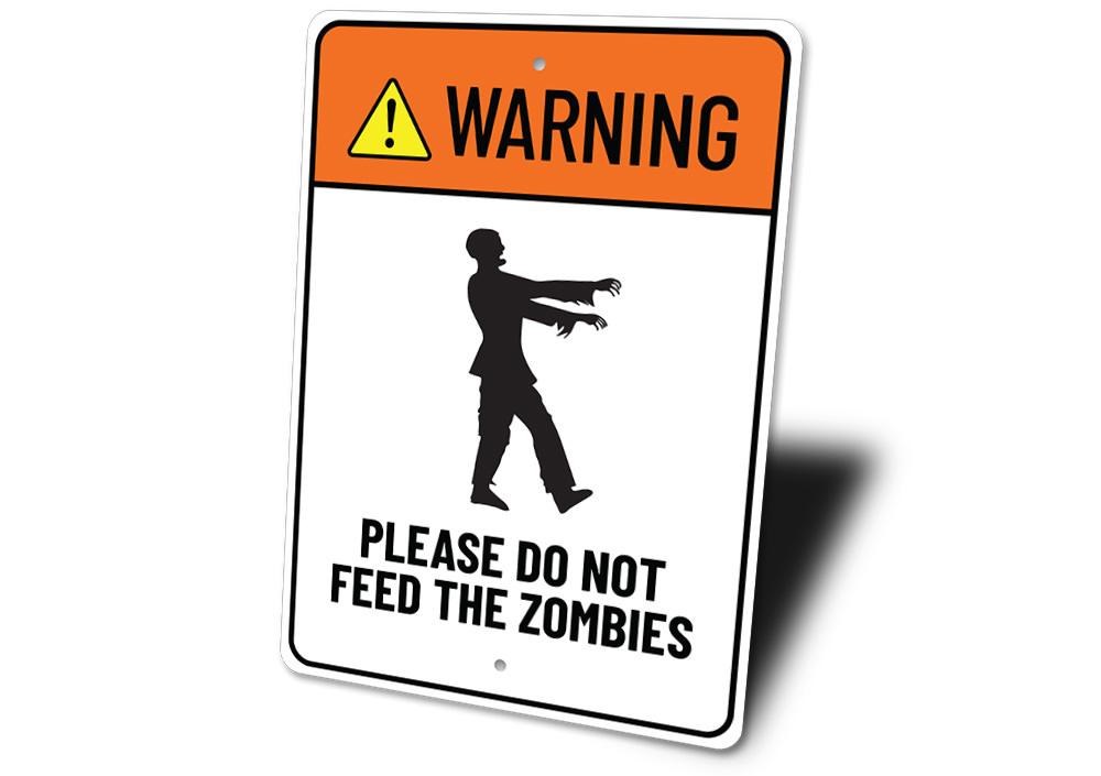 A decorative Do Not Feed Zombies sign made of aluminum, featuring spooky graphics perfect for Halloween decor.
