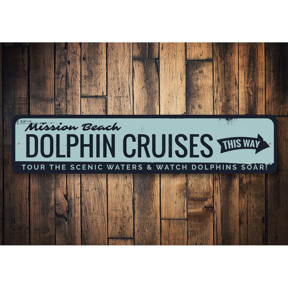 A decorative Dolphin Cruises sign made of high-quality aluminum, featuring vibrant colors and customizable text, perfect for beach-themed decor.