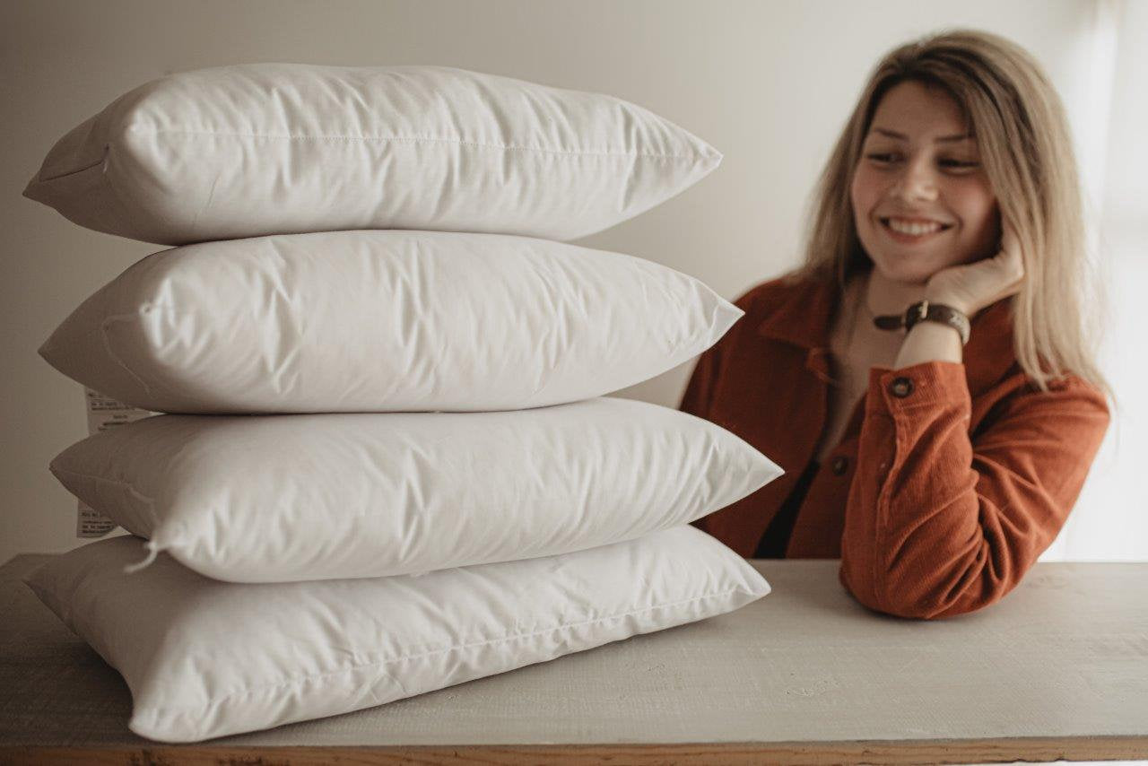 Down Alternative Hypoallergenic Pillow Insert with a soft cotton cover, showcasing its plush polyester fill and hand-made quality.