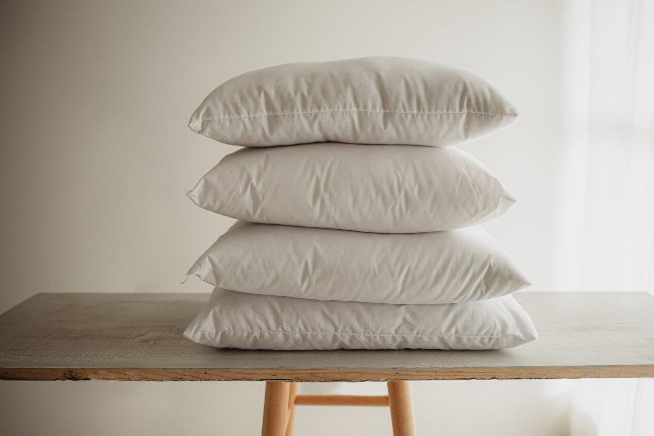 Down Alternative Hypoallergenic Pillow Insert with a soft cotton cover, showcasing its plush polyester fill and hand-made quality.