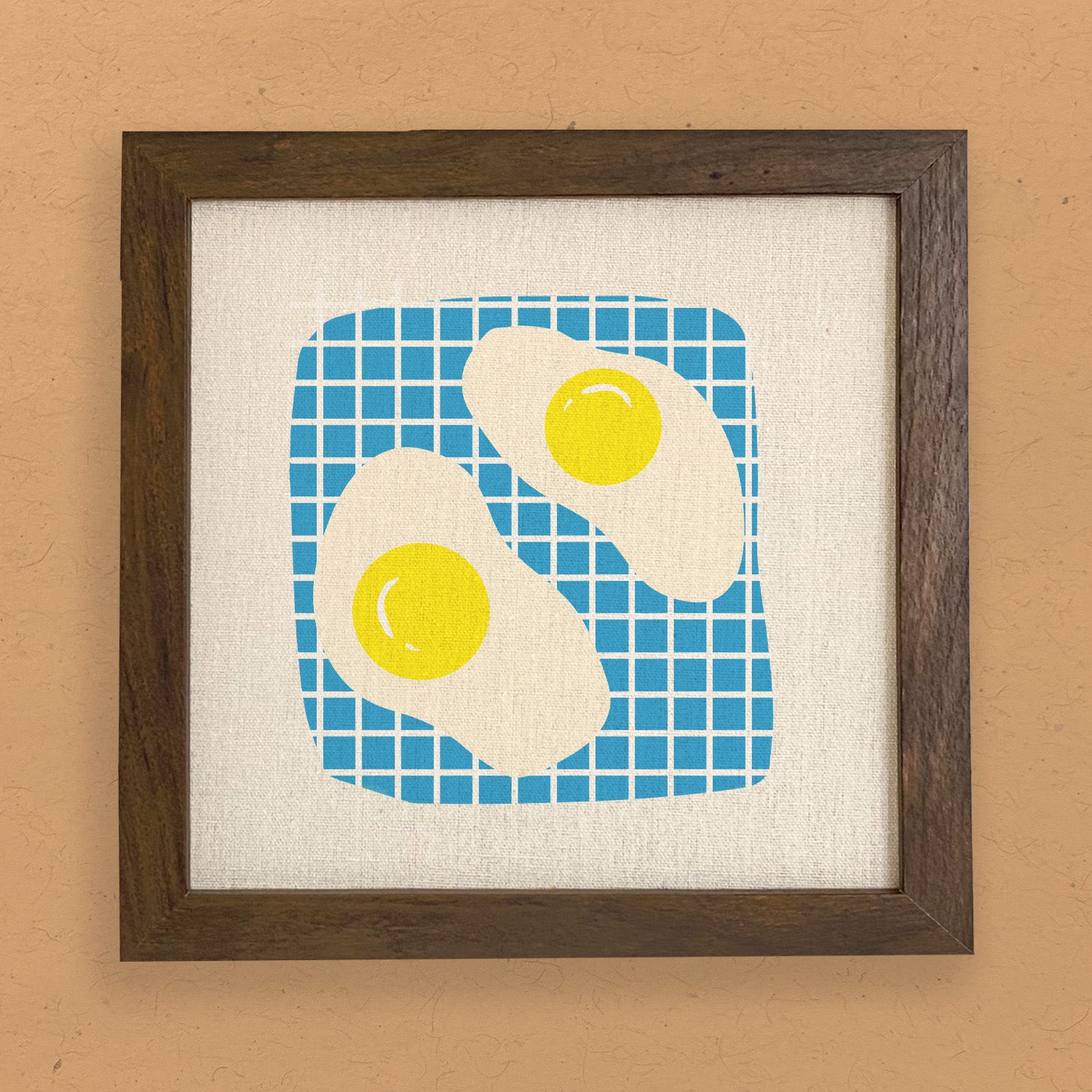 A beautifully crafted Eggs Framed Sign with a stylized wood frame, available in walnut or white-washed finish, featuring eco-friendly printing on a linen-look background.