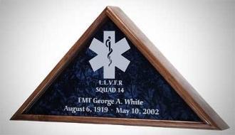 Walnut EMT flag display case showcasing a folded flag, featuring elegant glass front and personalized engraving options.