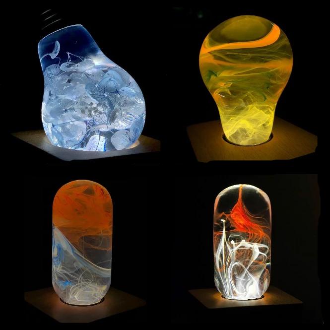 EP LIGHT 4-Pack LED Lights featuring unique handcrafted designs in eco-friendly resin, showcasing various colors and a wooden base.