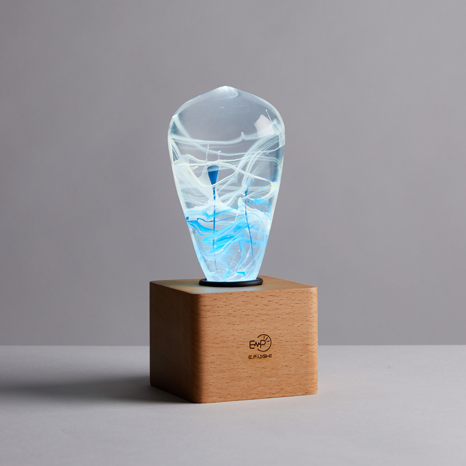 EP Light - Blue-drop Light showcasing a unique blue-drop design, made from eco-friendly resin and beech wood, perfect for any lamp.
