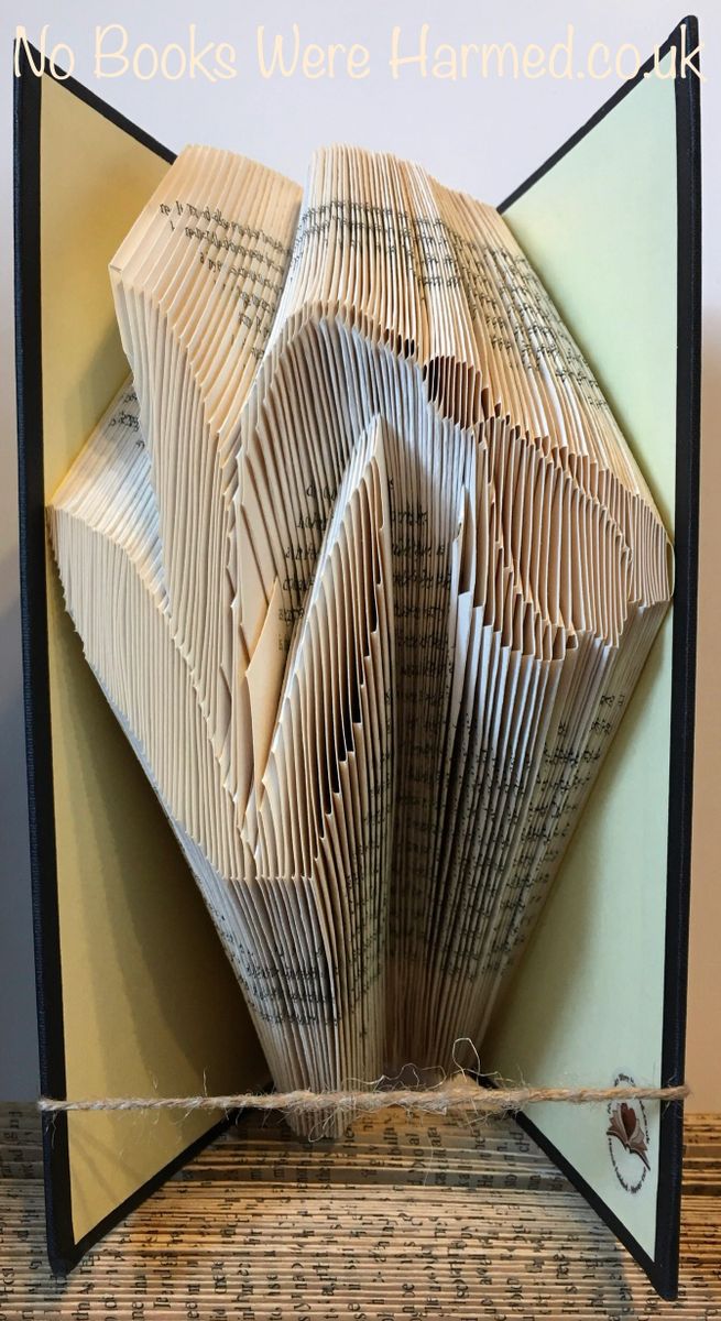 Everlasting Snowdrop flower book art, intricately hand-folded from vintage book pages, showcasing unique design and craftsmanship.