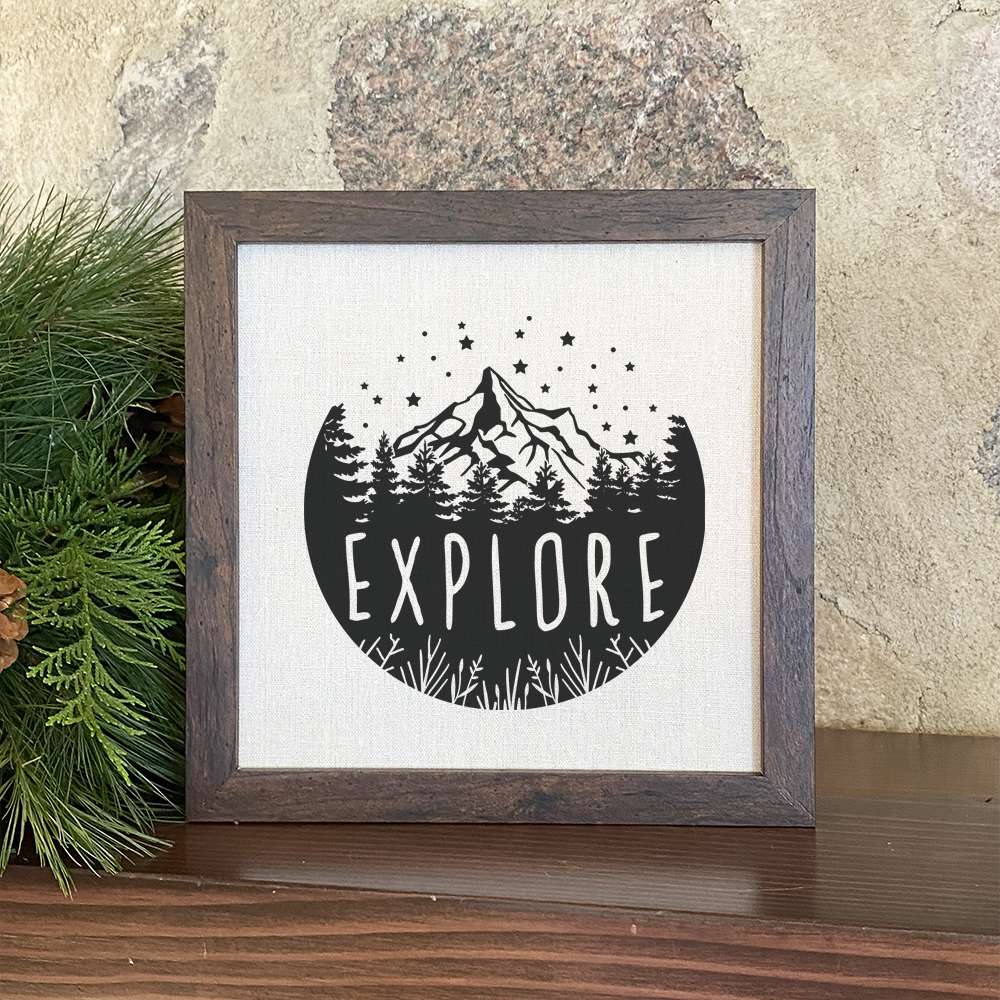 Explore Framed Sign with a stylish wood frame and linen-look background, perfect for shelf or wall display.