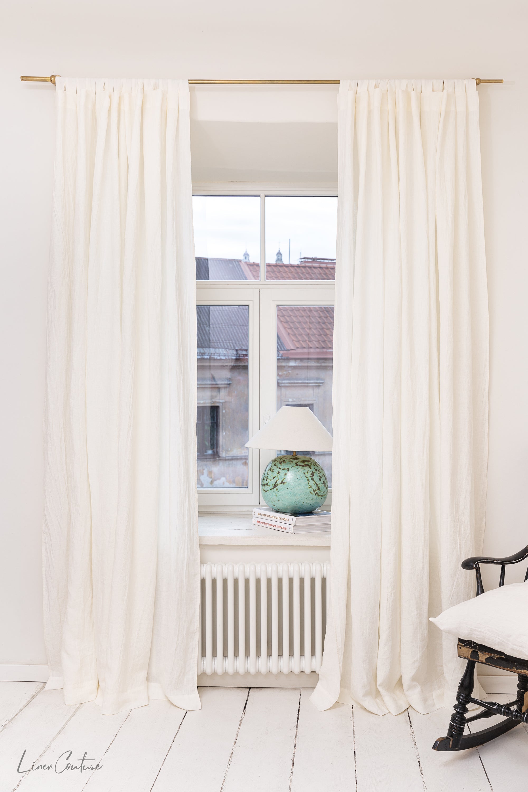 Extra wide white linen curtain panel with tab top, showcasing its elegant design and soft texture.