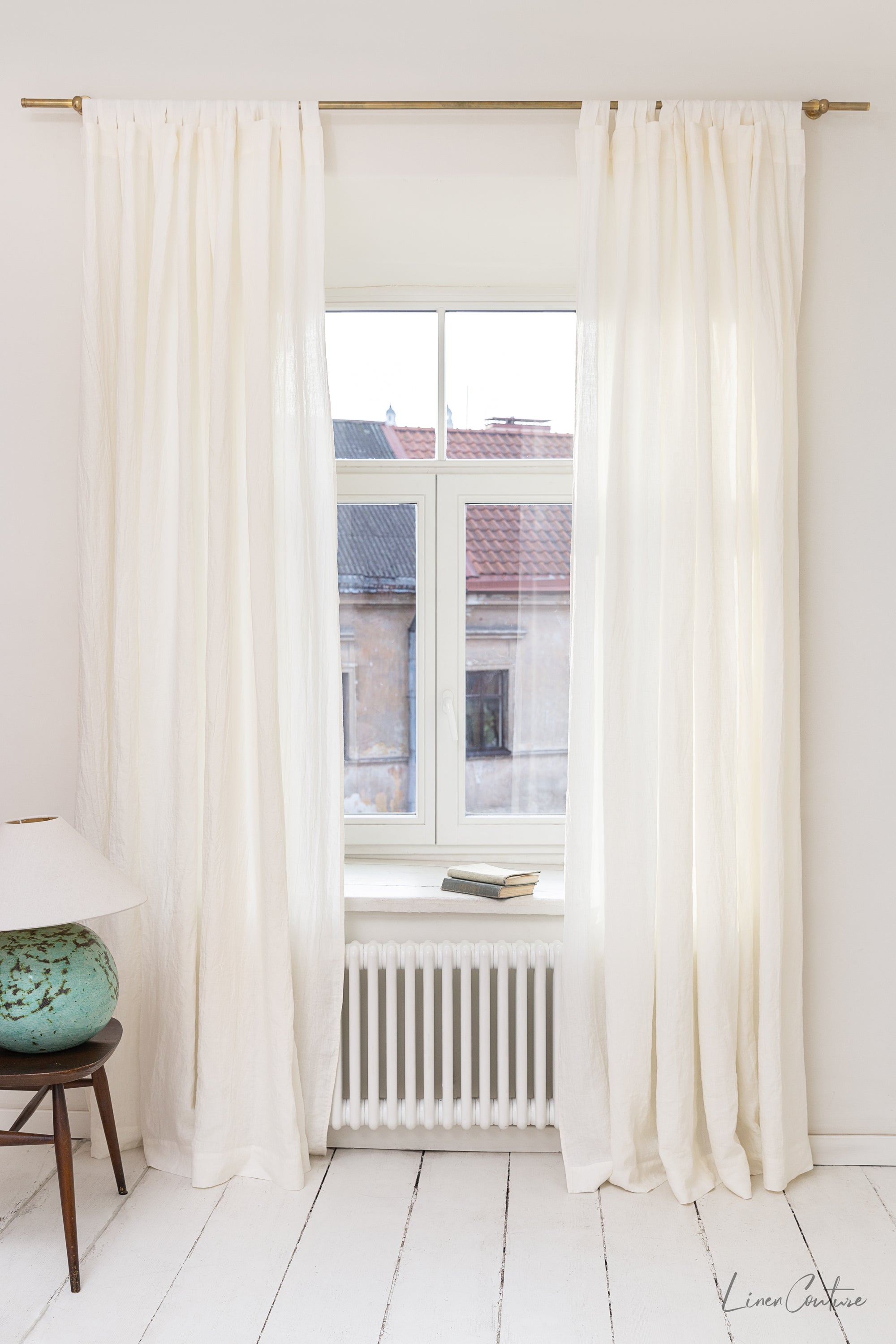 Extra wide white linen curtain panel with tab top, showcasing its elegant design and soft texture.