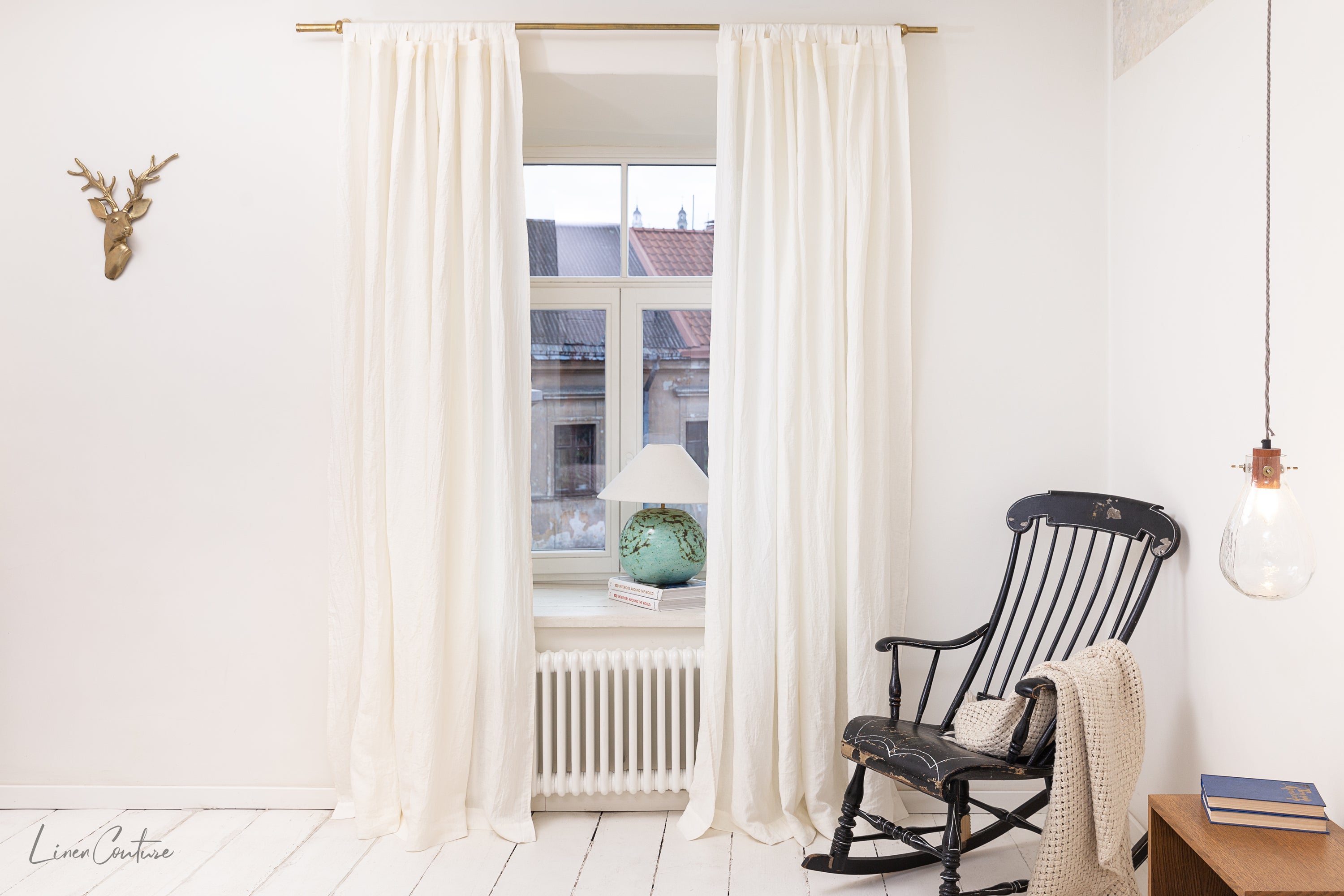 Extra wide white linen curtain panel with tab top, showcasing its elegant design and soft texture.