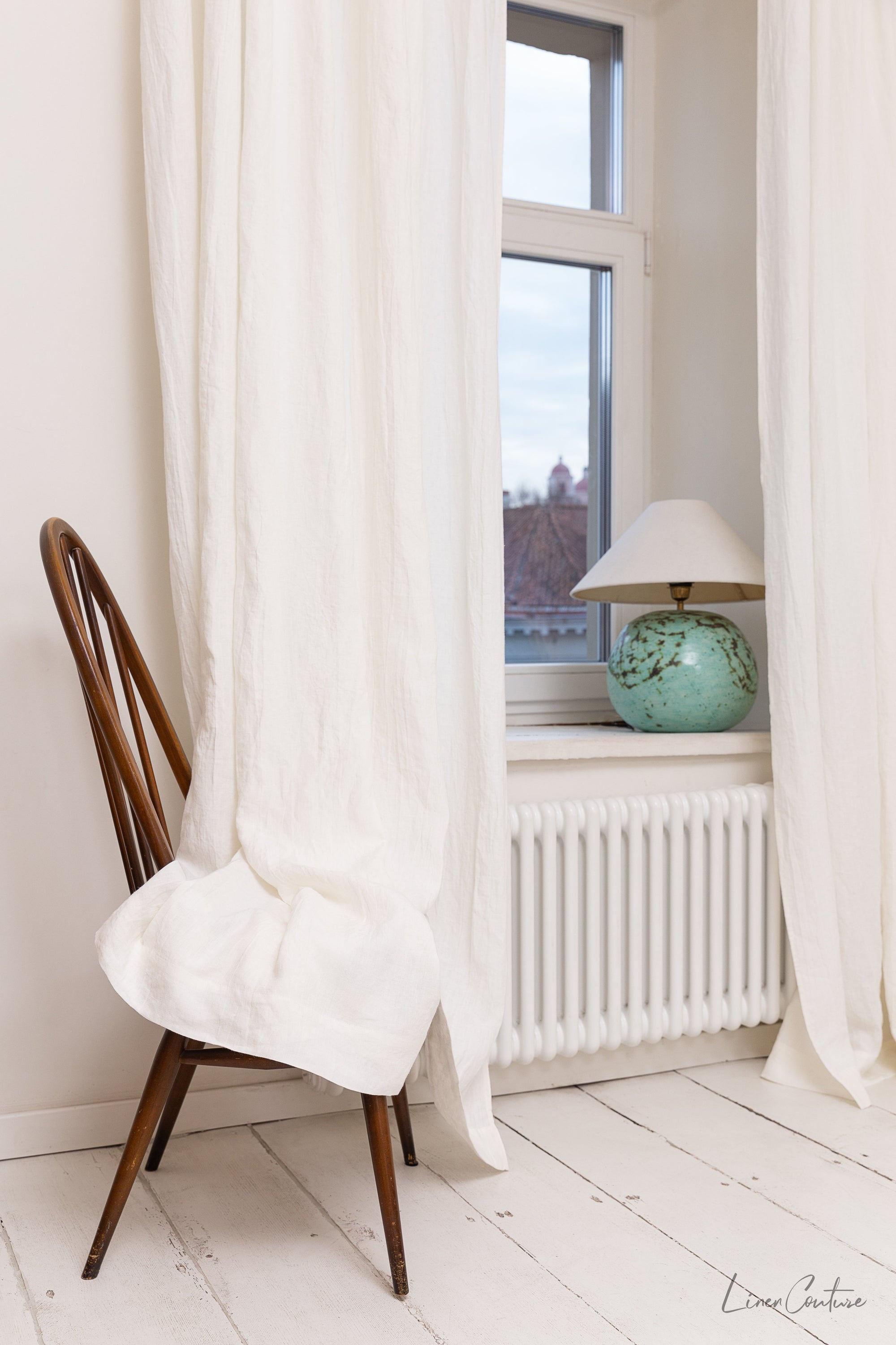 Extra wide white linen curtain panel with tab top, showcasing its elegant design and soft texture.
