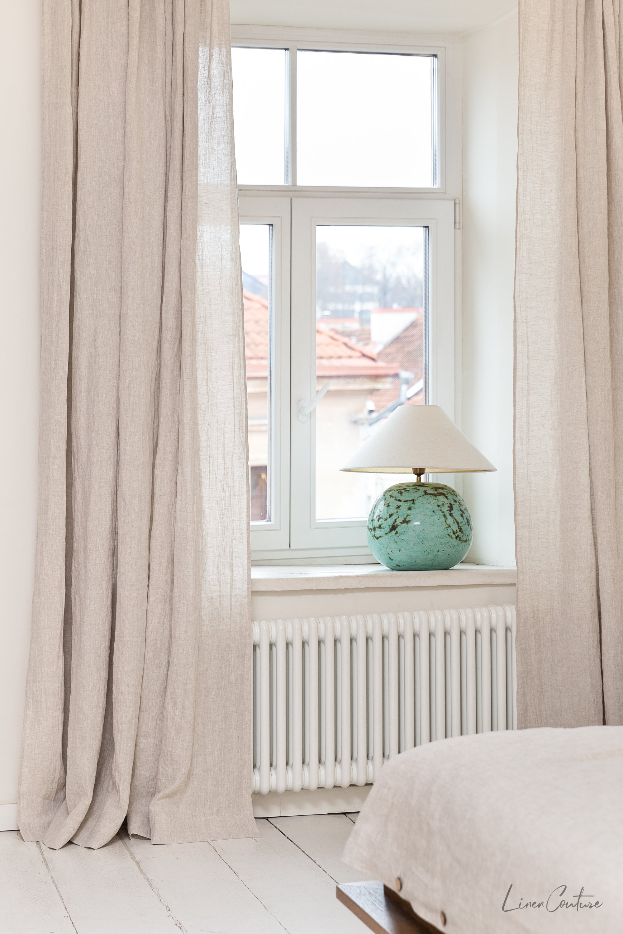 Extra wide white linen curtain panel with tab top, showcasing its elegant design and soft texture.