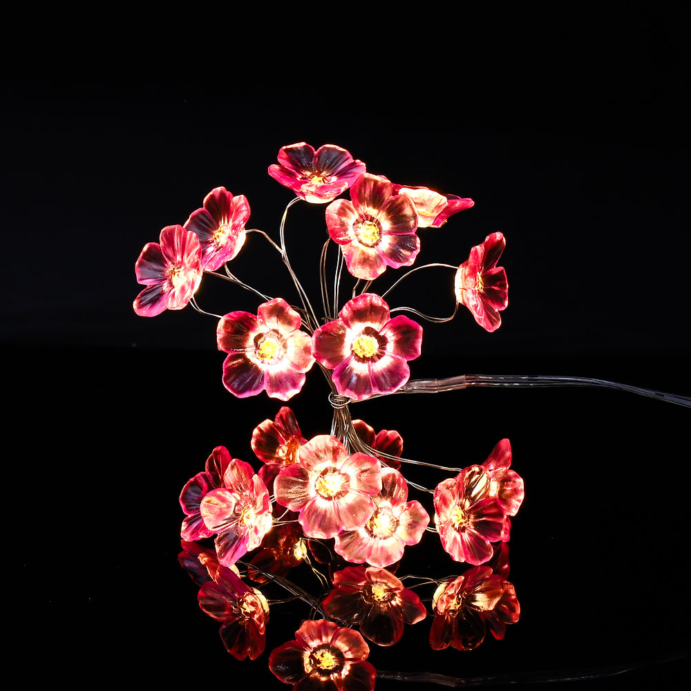 A 10ft string of fairy lights featuring 30 pink cherry blossom LEDs, perfect for indoor and outdoor decoration.