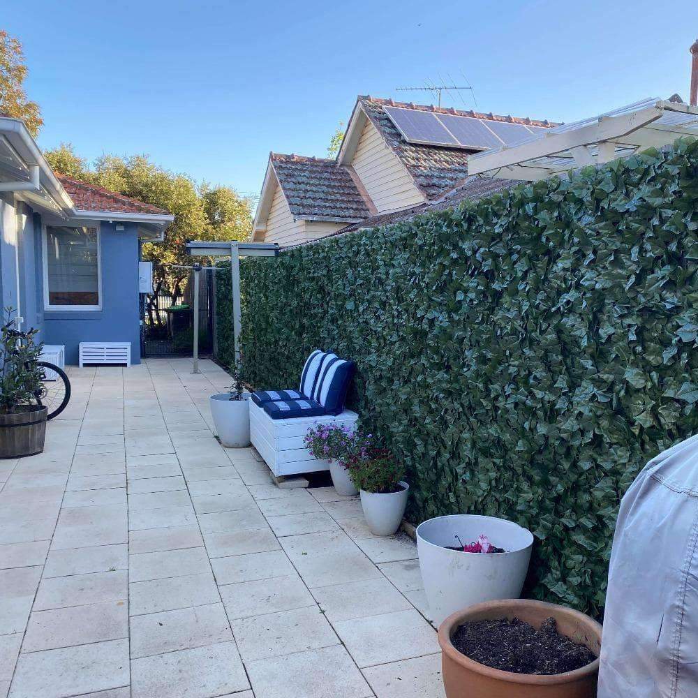 Fake Ivy Roll 3m x 1m showcasing realistic green foliage, perfect for creating an artificial hedge panel for privacy and decoration.