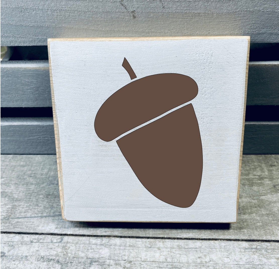 A set of three hand-painted mini wood signs featuring fall leaves and an acorn, perfect for tiered tray decor.