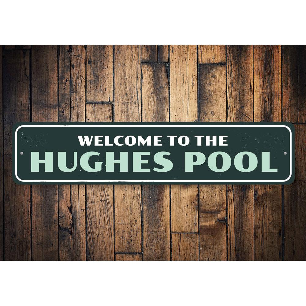 A decorative Family Pool Welcome Sign made of durable aluminum, featuring customizable text and pre-drilled holes for easy mounting.