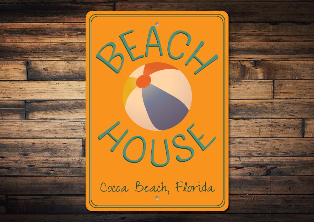 A decorative Favorite Beach House Sign made of high-quality aluminum, featuring customizable text and pre-drilled holes for easy mounting.