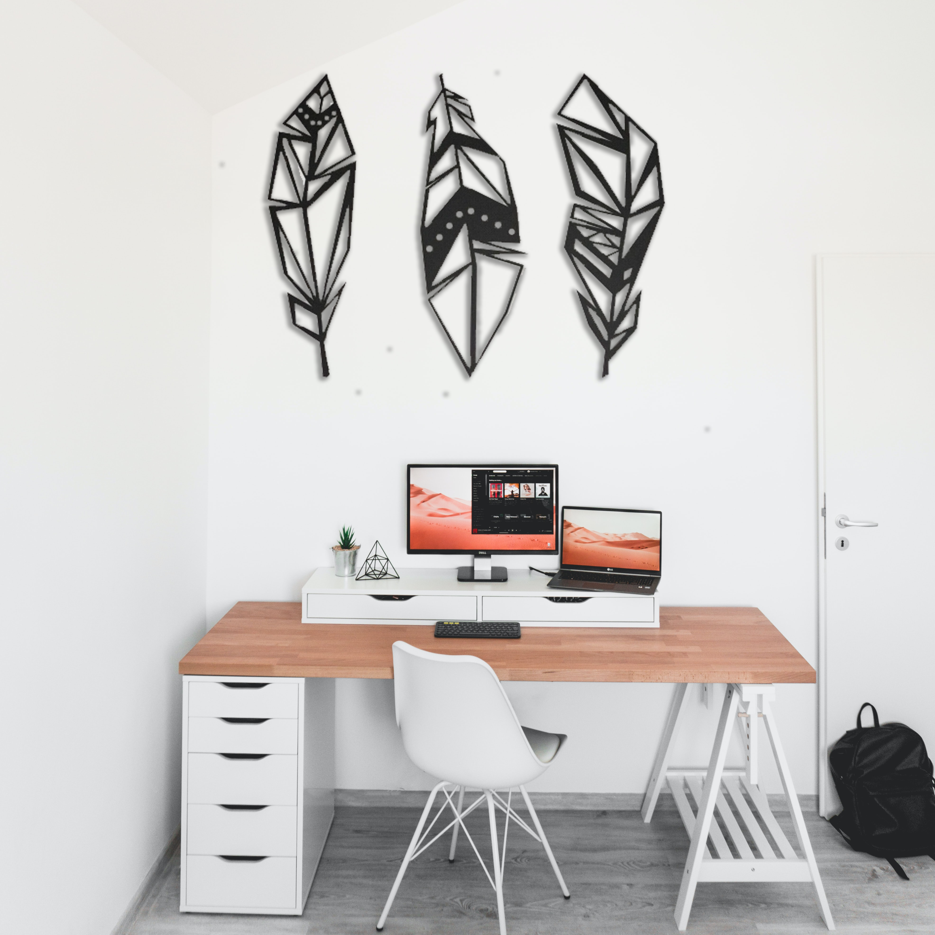 Three geometric metal feathers wall art set, symbolizing charity, hope, and faith, with a sleek powder-coated finish.