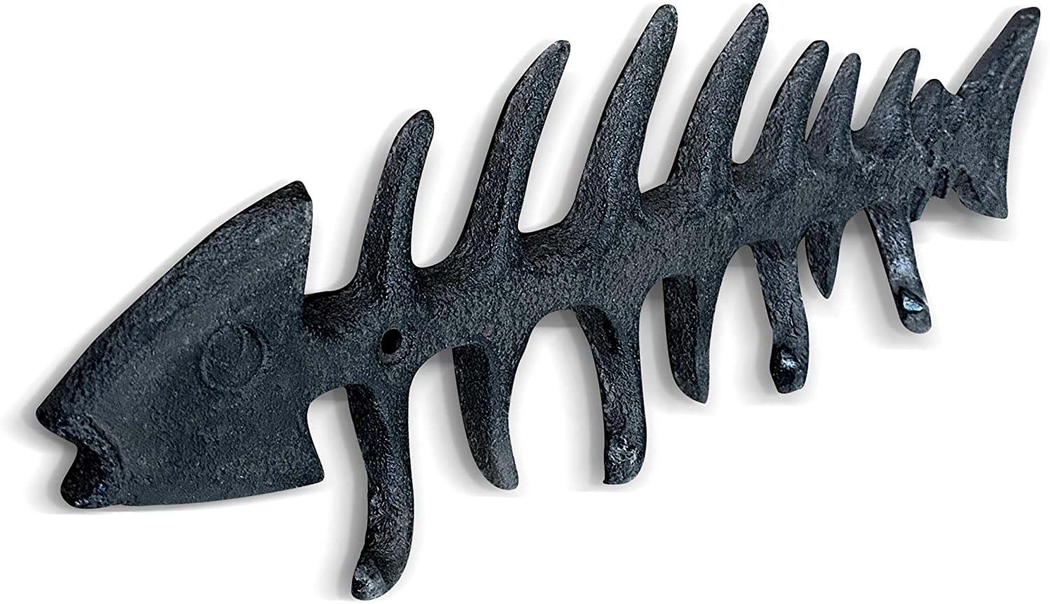 A set of unique fish bones wall hooks made of cast iron, featuring a rustic design with four hooks for hanging items.