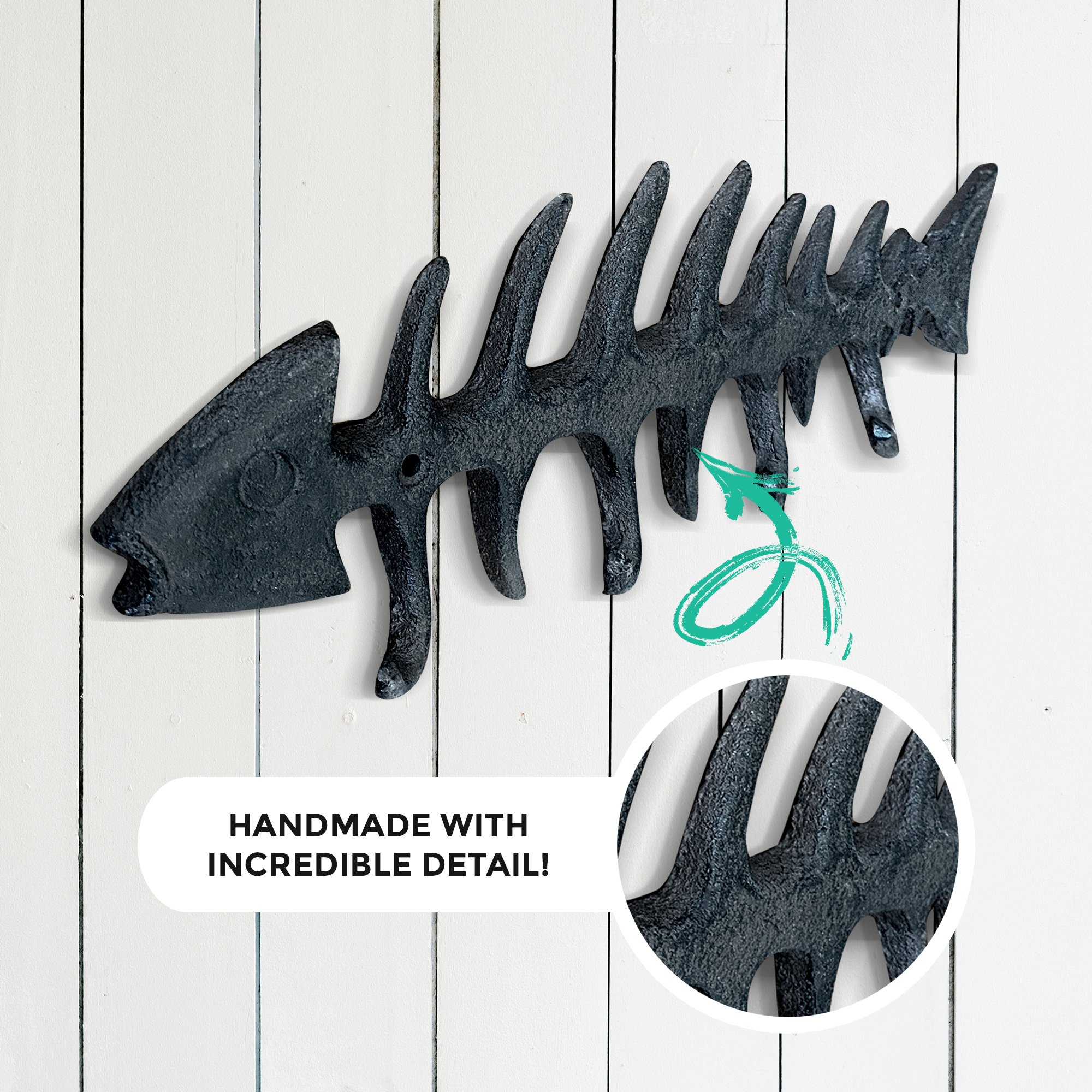 A set of unique fish bones wall hooks made of cast iron, featuring a rustic design with four hooks for hanging items.