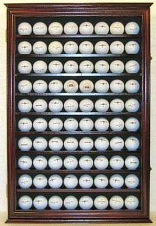 Flag Connections 80 Golf Ball Display Case with dark green felt background and acrylic door cover, showcasing multiple golf balls securely.